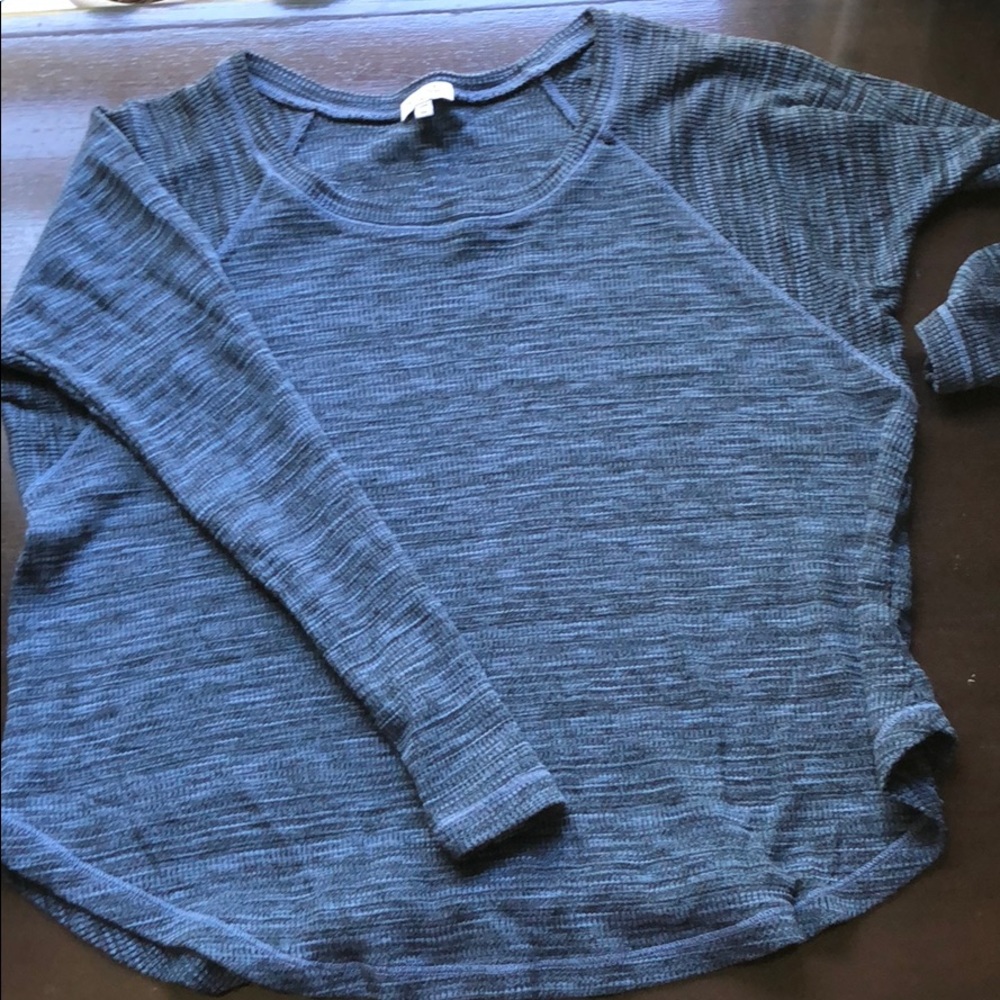 A blue top that Is long sleeve